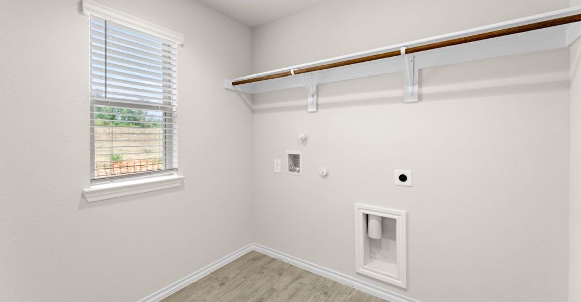 Representative exterior photo of a completed home built from the Austin by Impression Homes in Keeneland, Aubrey, TX (Image 22).