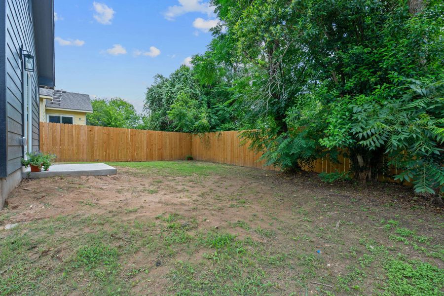 View of fenced backyard