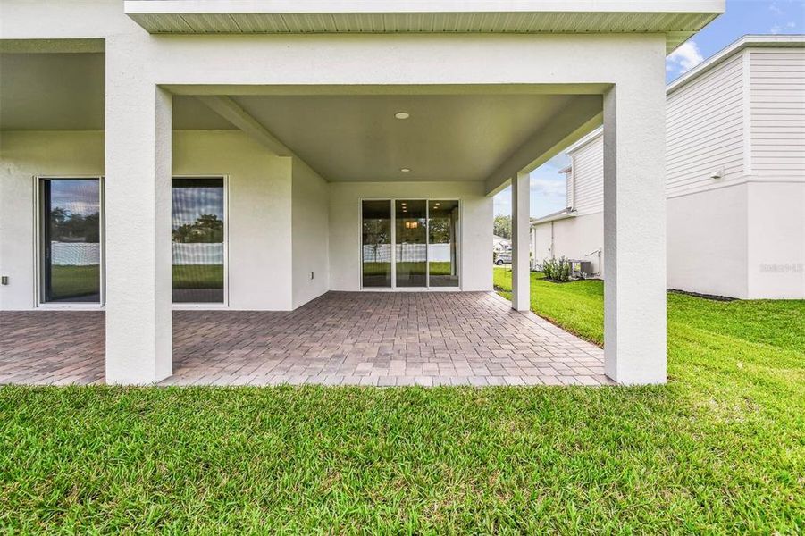 Exterior details and patio area of a home in Solace at Corner Lake, Orlando (Image 33).