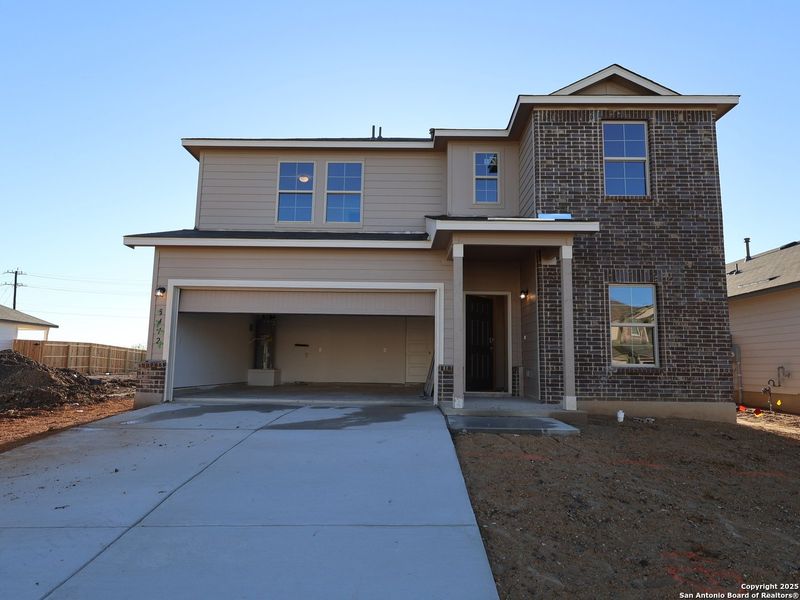 Front exterior of a new home in Agave, San Antonio, TX, highlighting curb appeal (Image 2). Front exterior of a new home in Agave, San Antonio, TX, highlighting curb appeal (Image 2).