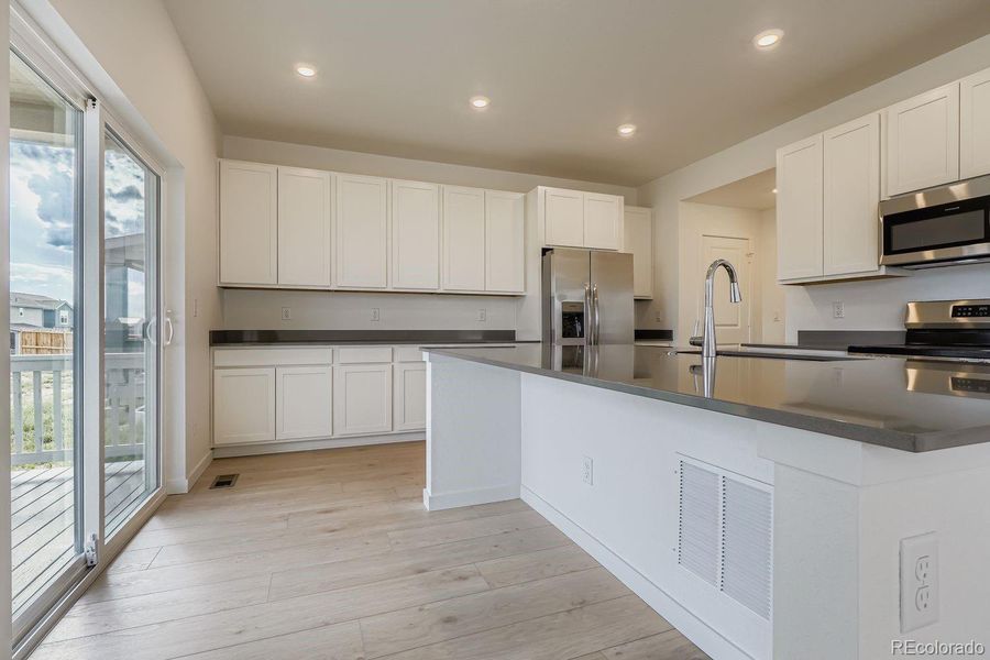 Furnished interior view inside a new home in Sky Ranch: Pioneer Collection, Watkins (Image 7).