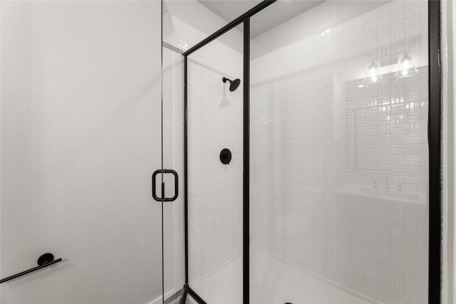 Full bath with a shower stall
