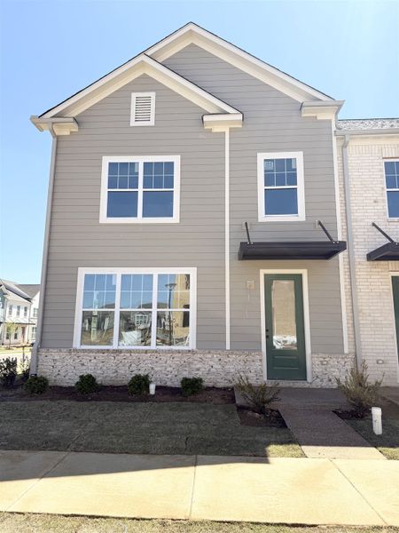 View of front of house featuring brick siding