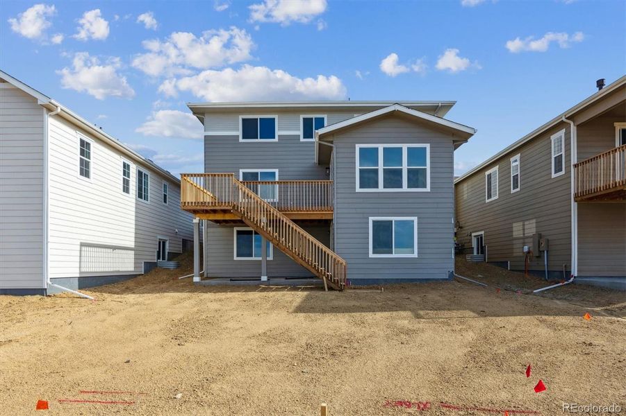Exterior details and patio area of a home in Harvest Crossing, Aurora (Image 17).