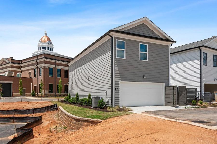 Front exterior of a new home in Harmony, Auburn, GA, highlighting curb appeal (Image 23). Front exterior of a new home in Harmony, Auburn, GA, highlighting curb appeal (Image 23).