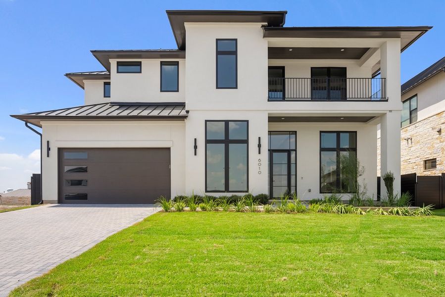 Front exterior of a new home in Milky Way at River Place, Austin, TX, highlighting curb appeal (Image 1).