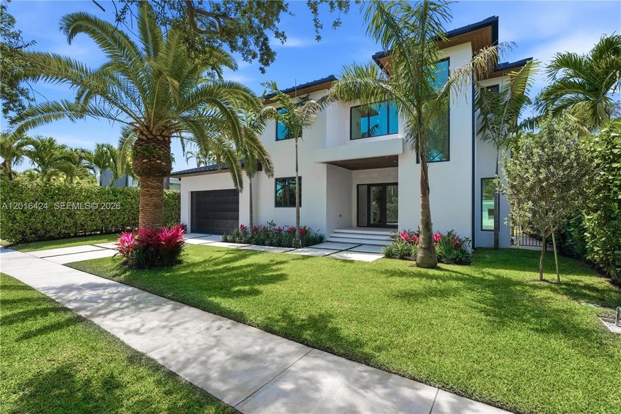 Front exterior of a new home in , North Miami, FL, highlighting curb appeal (Image 27).