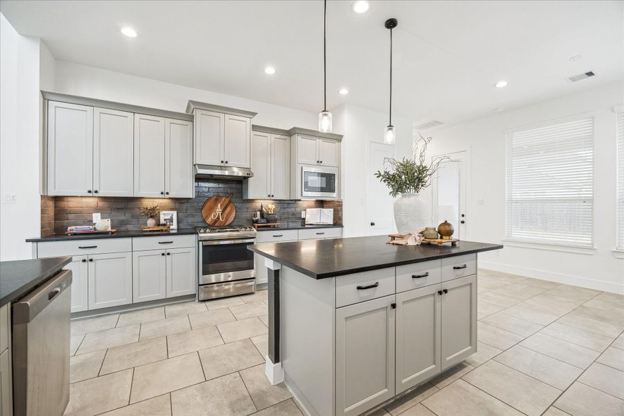 J Kraft cabinets, SS appliances and plenty of counter space