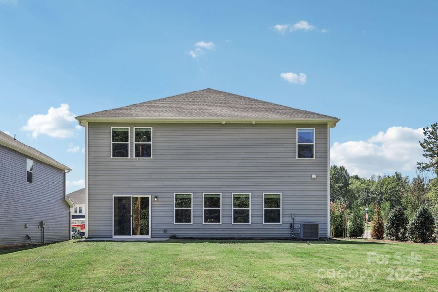 Front exterior of a new home in Nelson's Creek, Mocksville, NC, highlighting curb appeal (Image 2). Front exterior of a new home in Nelson's Creek, Mocksville, NC, highlighting curb appeal (Image 2).
