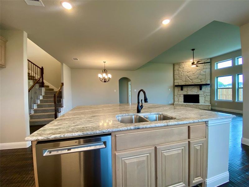 Island offers GE stainless dishwasher, stainless single basin sink, and extendable ORB faucet