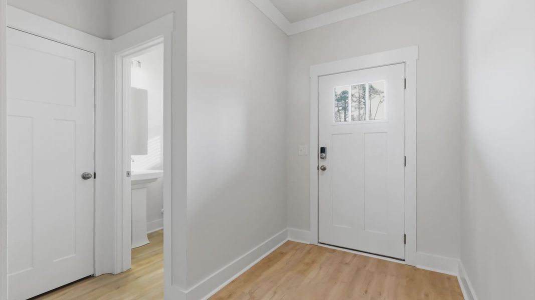 Established style and superior craftsmanship evident from the hardwood foyer entry at this villa in Greenville, SC