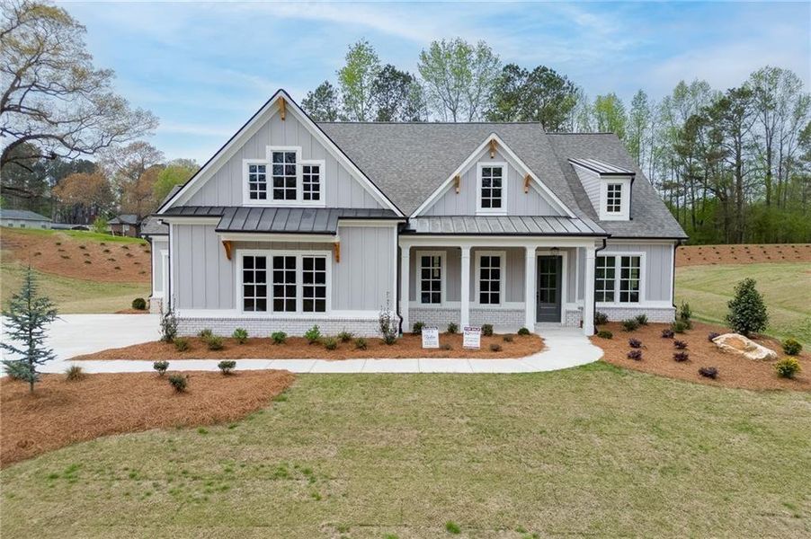 Front exterior of a new home in , Cumming, GA, highlighting curb appeal (Image 24).