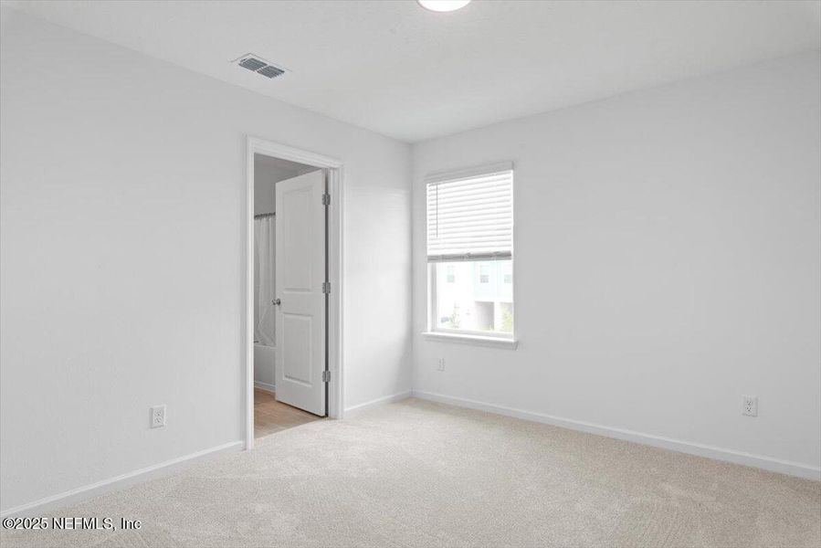 Spacious, unfurnished interior of a new home in Hardwick Farms: Hardwick Farms - Townhome Collection, Jacksonville (Image 20).