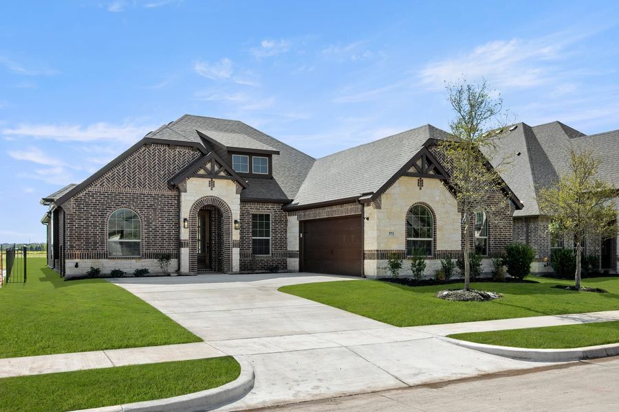 Front exterior of a new home in Abe’s Landing, Granbury, TX, highlighting curb appeal (Image 21). Front exterior of a new home in Abe’s Landing, Granbury, TX, highlighting curb appeal (Image 21).
