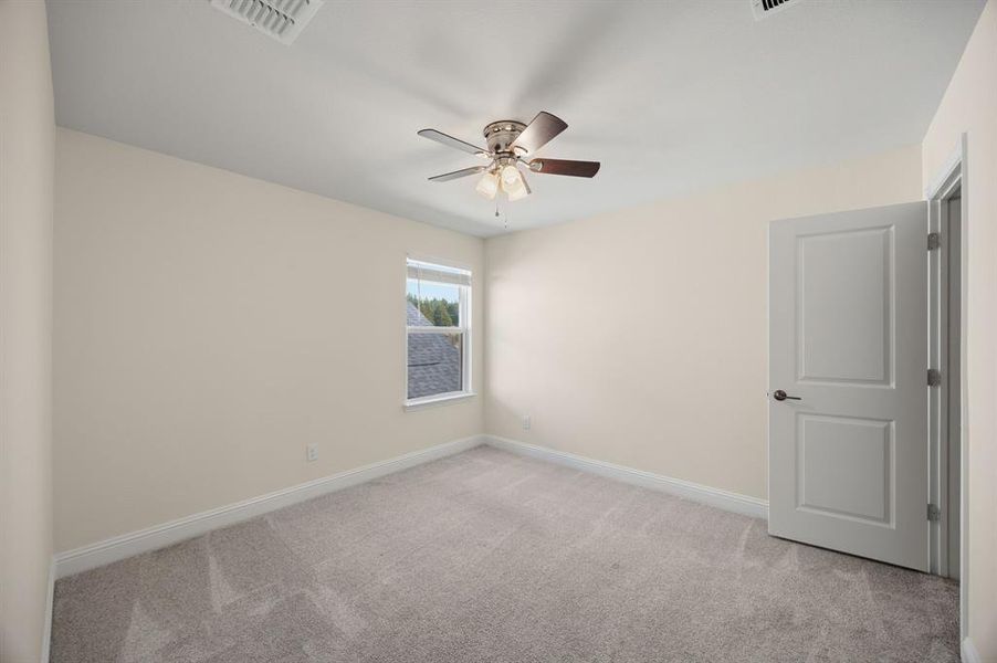 Upstairs bedroom with walk in closet. Shares a hall bathroom.