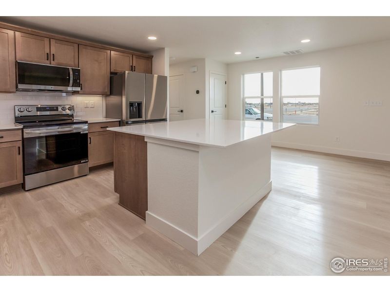 Furnished interior view inside a new home in Prairie Song Story Collection - Single Family Homes, Windsor (Image 5).