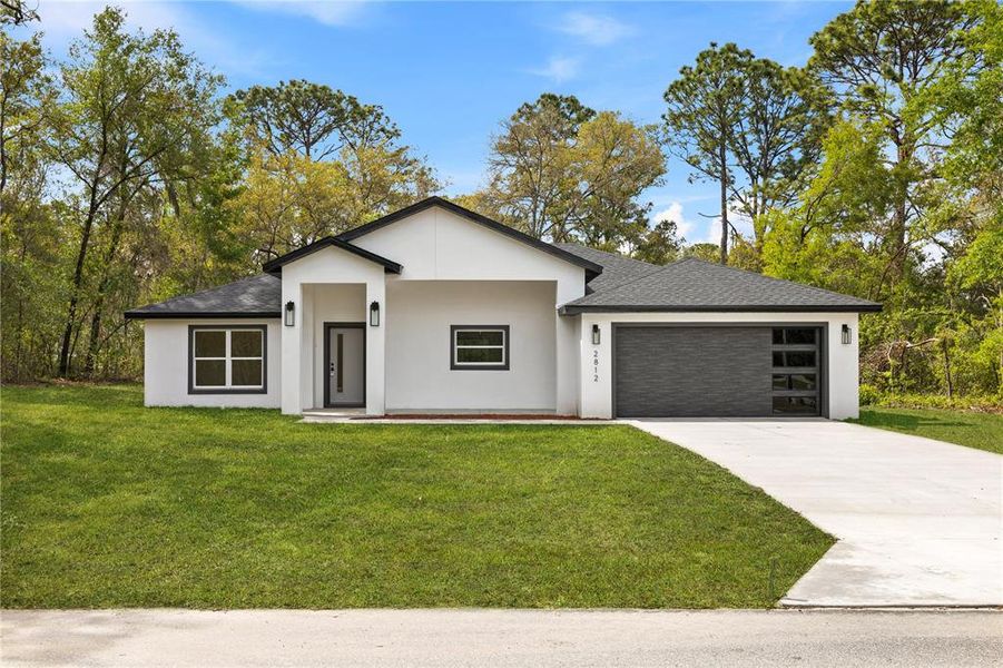 Front exterior of a new home in , Dunnellon, FL, highlighting curb appeal (Image 29).