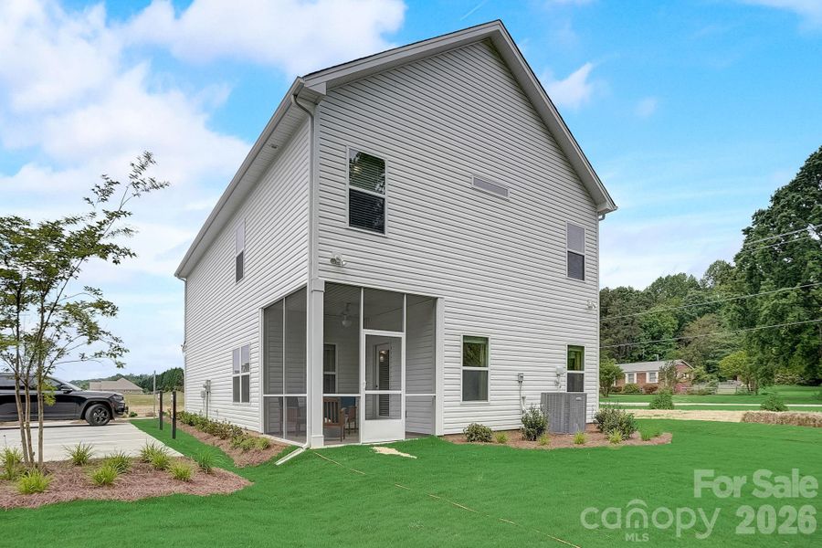 Exterior details and patio area of a home in Country Club Village, Salisbury (Image 21).