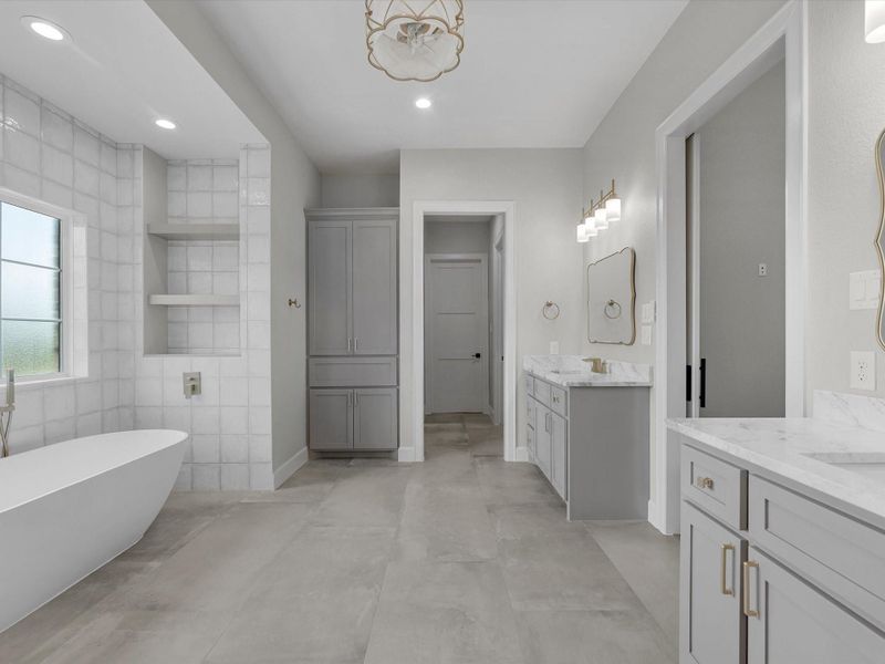 Spa-inspired primary bath featuring soaking tub, walk-in shower, and elegant finishes.