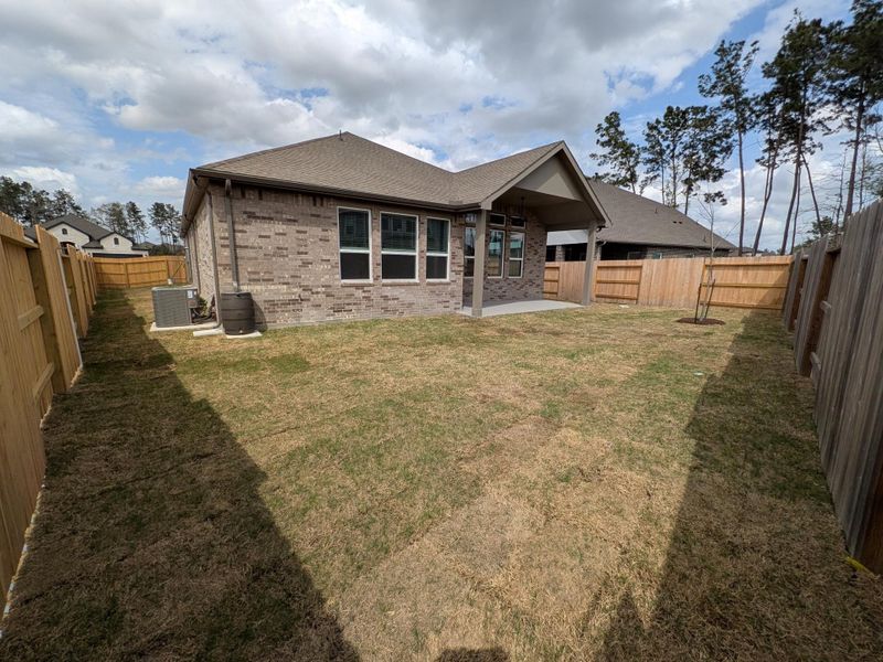 Exterior details and patio area of a home in Artavia, Conroe (Image 14).