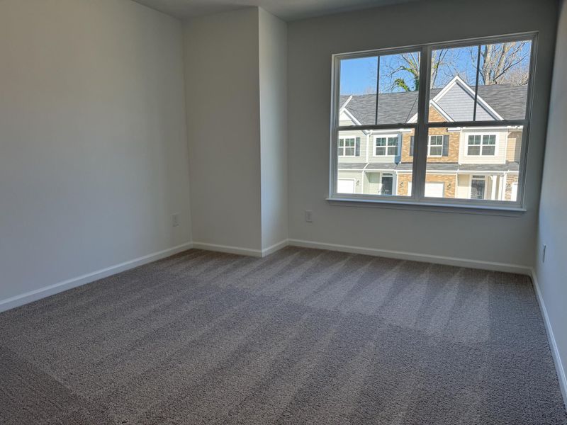 Spacious, unfurnished interior of a new home in East Main Townes, Spartanburg (Image 18).