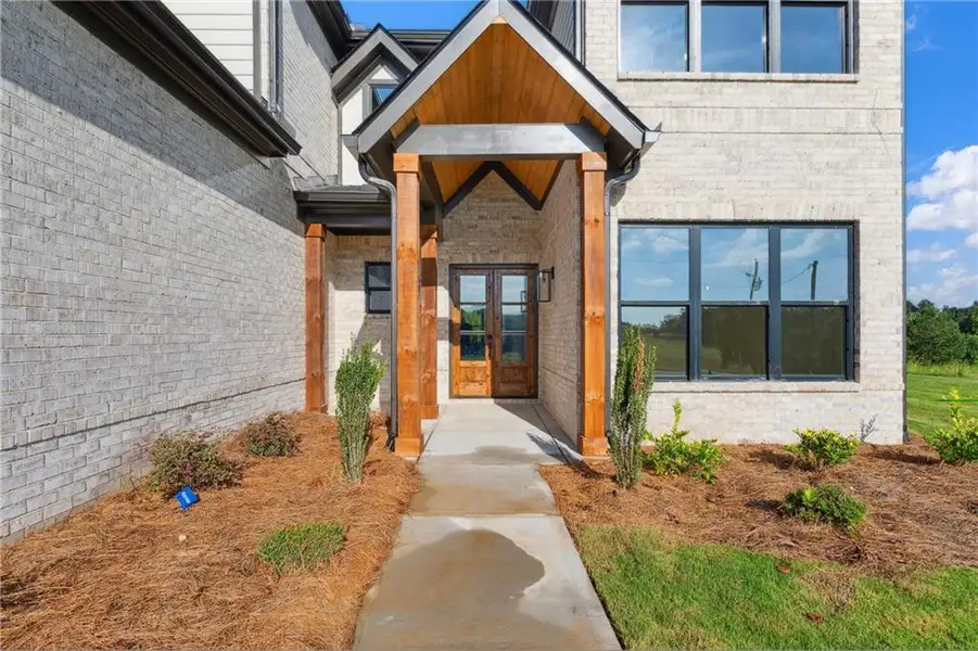 Front exterior of a new home in , Jefferson, GA, highlighting curb appeal (Image 2).