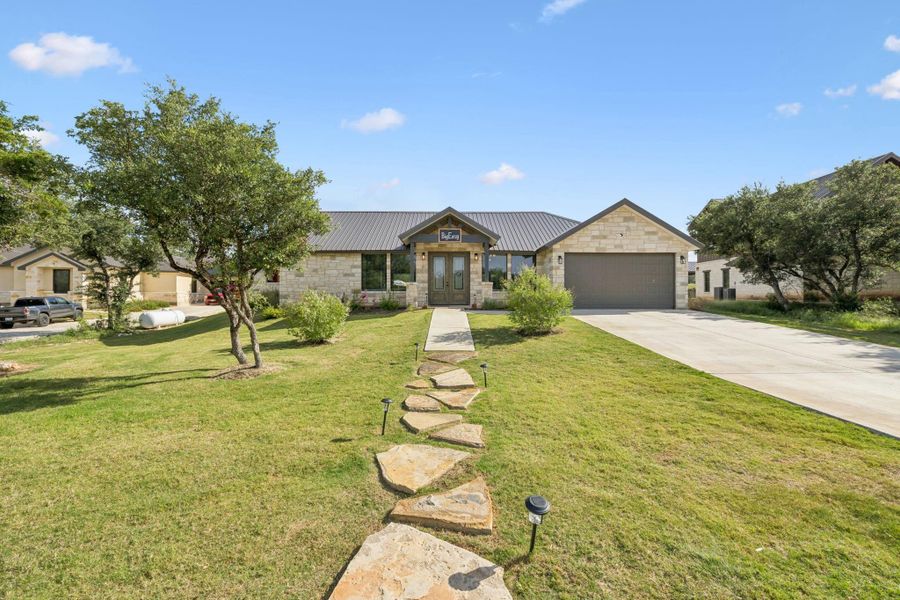 Front exterior of a new home in , Concan, TX, highlighting curb appeal (Image 19). Front exterior of a new home in , Concan, TX, highlighting curb appeal (Image 19).