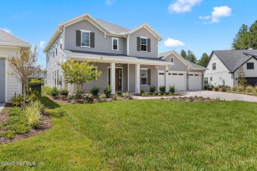Front exterior of a new home in , St. Johns, FL, highlighting curb appeal (Image 20). Front exterior of a new home in , St. Johns, FL, highlighting curb appeal (Image 20).