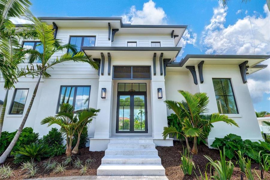 Front exterior of a new home in , Longboat Key, FL, highlighting curb appeal (Image 2). Front exterior of a new home in , Longboat Key, FL, highlighting curb appeal (Image 2).