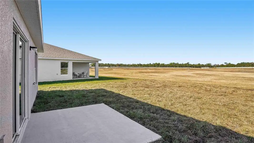 Exterior details and patio area of a home in Fletcher Trace, Alachua (Image 2). Exterior details and patio area of a home in Fletcher Trace, Alachua (Image 2).