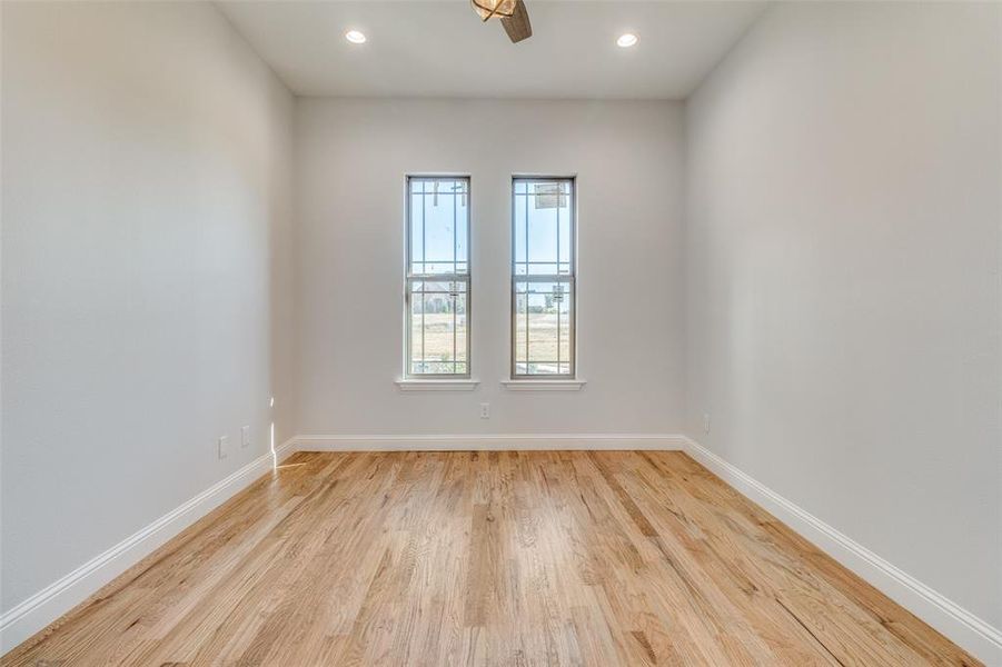 Unfurnished room featuring light hardwood / wood-style floors and ceiling fan