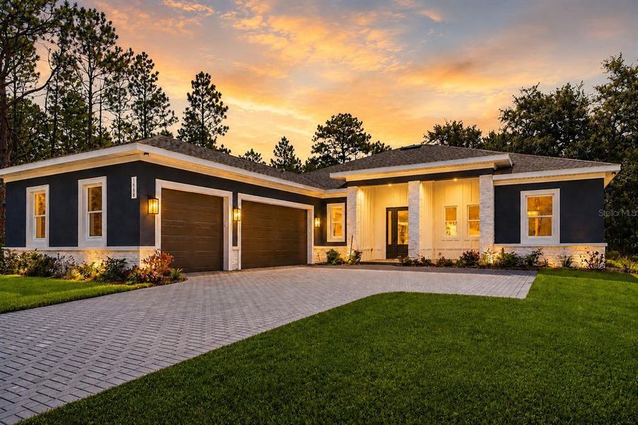 Front exterior of a new home in , Weeki Wachee, FL, highlighting curb appeal (Image 33).