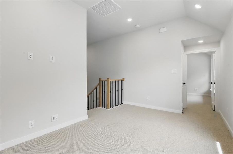 Bonus room with light colored carpet, recessed lighting, and vaulted ceiling