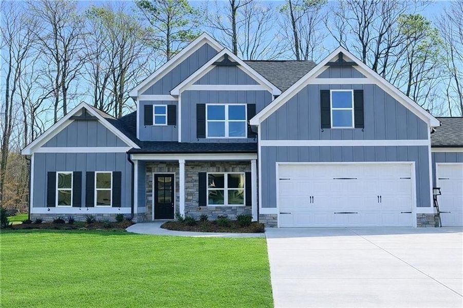 Front exterior of a new home in , Dallas, GA, highlighting curb appeal (Image 1). Front exterior of a new home in , Dallas, GA, highlighting curb appeal (Image 1).