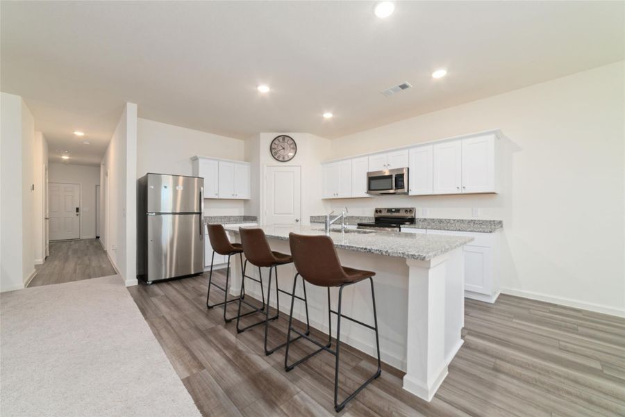 Furnished interior view inside a new home in Sunterra, Katy (Image 18).