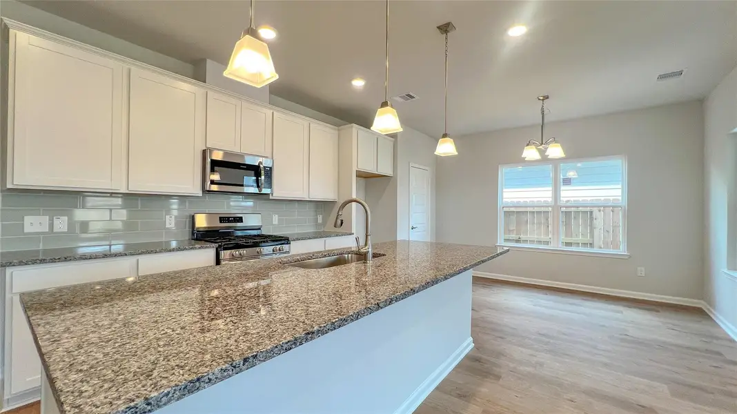 The Brambling- Kitchen. Sample floor plan image for illustration; upgrades, options, and colors may vary.