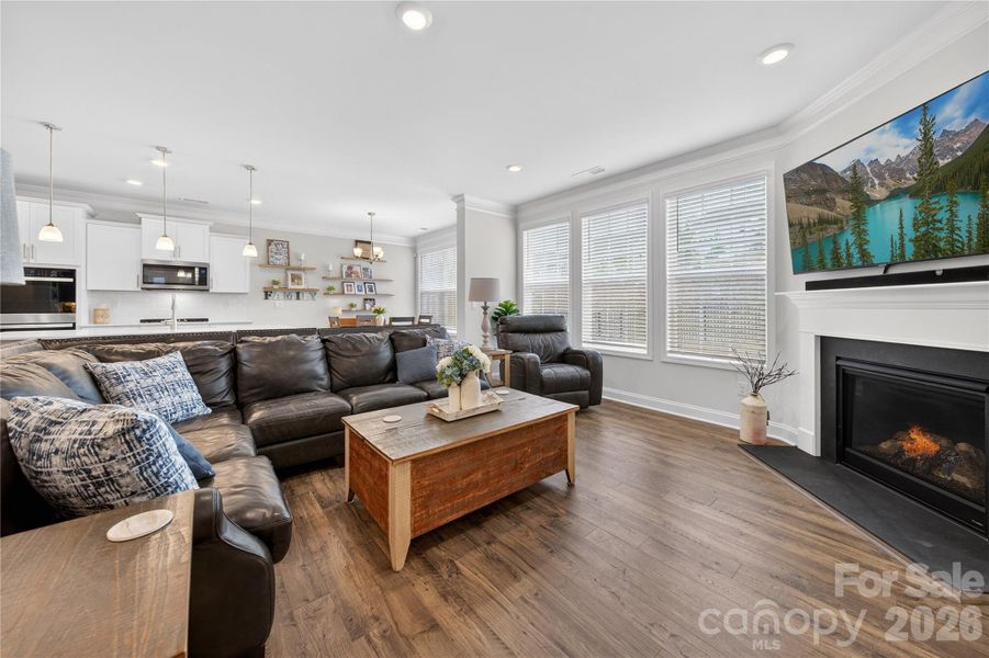 Large windows overlook backyard, allow natural light to saturate the main level.