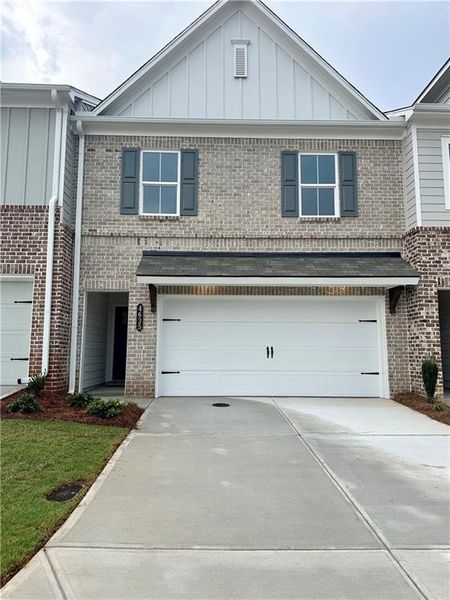Front exterior of a new home in Wilkins Walk, Mableton, GA, highlighting curb appeal (Image 1). Front exterior of a new home in Wilkins Walk, Mableton, GA, highlighting curb appeal (Image 1).