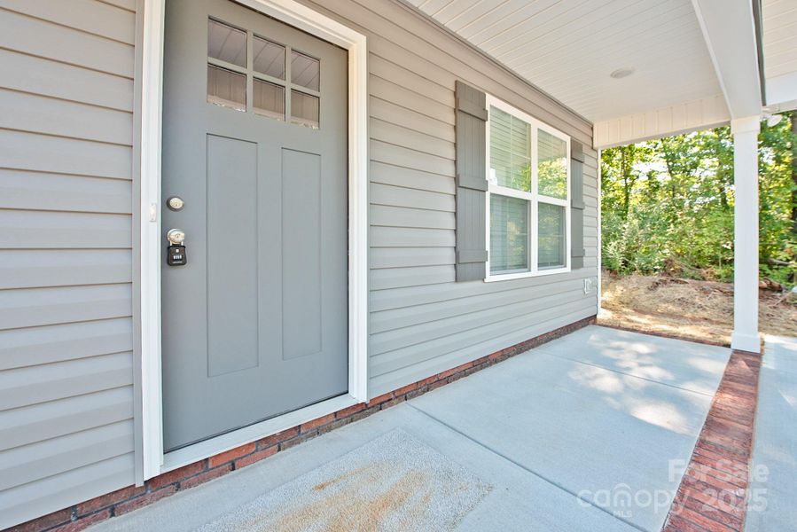 Front exterior of a new home in , Concord, NC, highlighting curb appeal (Image 13). Front exterior of a new home in , Concord, NC, highlighting curb appeal (Image 13).
