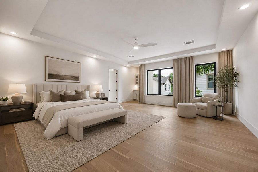 Designed as a true retreat, the expansive primary suite pairs soaring tray ceilings with full height windows and natural light. A sitting area and direct connection to the spa inspired primary bath create a peaceful escape, complete with its own dedicated AC unit. A discreet flex space behind the suite is pre-wired for AV termination - ready as a media closet, hardwired security/camera room, or private gun room, if desired. **Virtually staged**