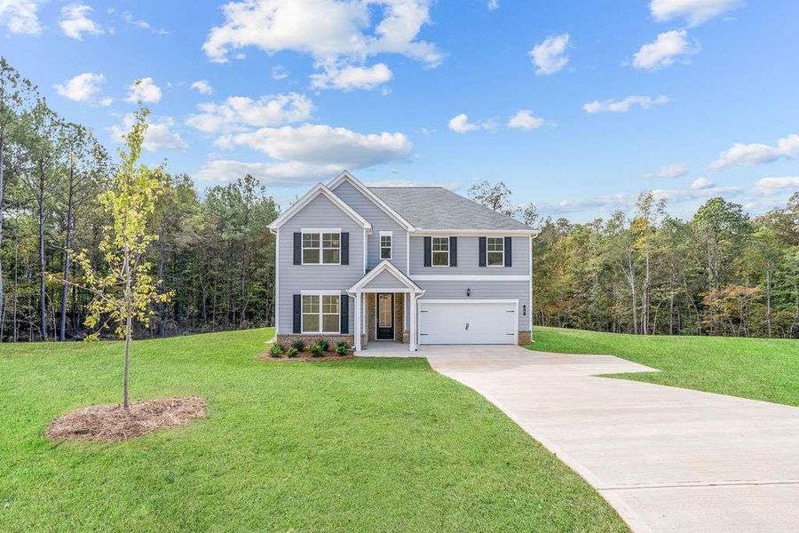 Front exterior of a new home in Waters Edge, Mansfield, GA, highlighting curb appeal (Image 15).