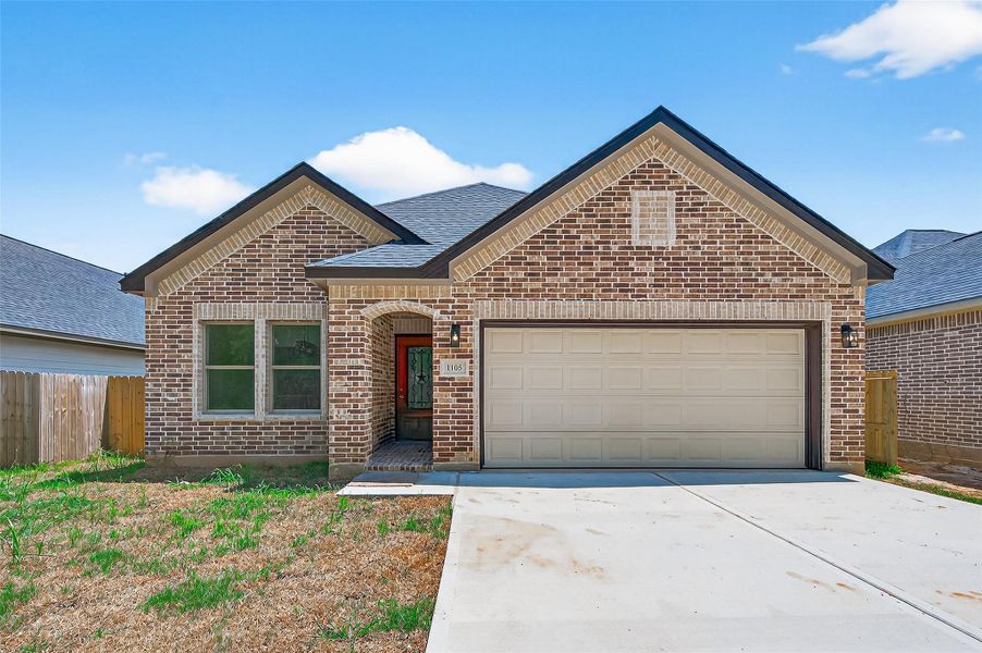 This charming, single-story brick home features a welcoming front entrance with a spacious two-car garage. This charming, single-story brick home features a welcoming front entrance with a spacious two-car garage.