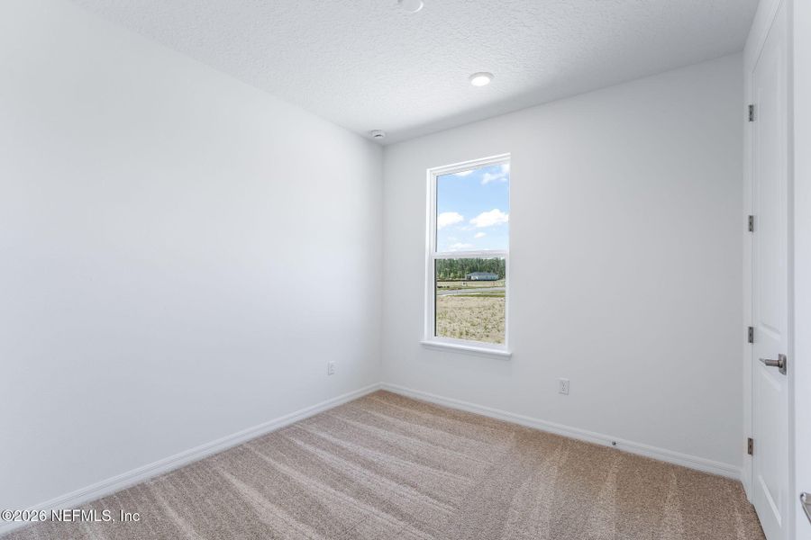 Spacious, unfurnished interior of a new home in Del Webb Wildlight, Yulee (Image 34).