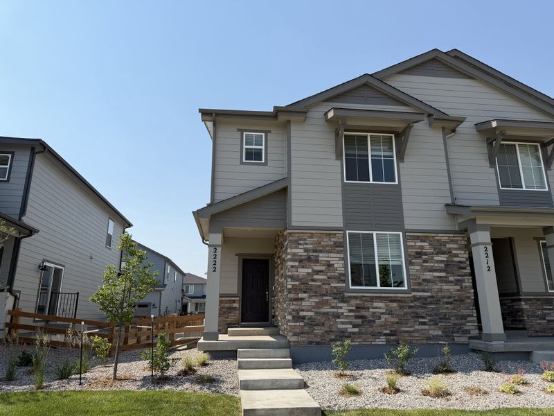 Front exterior of a new home in York Station, Brighton, CO, highlighting curb appeal (Image 1). Front exterior of a new home in York Station, Brighton, CO, highlighting curb appeal (Image 1).