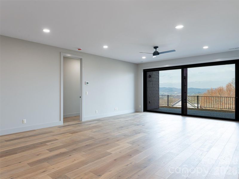 Family Room in Basement with sliding glass doors to terrace level patio