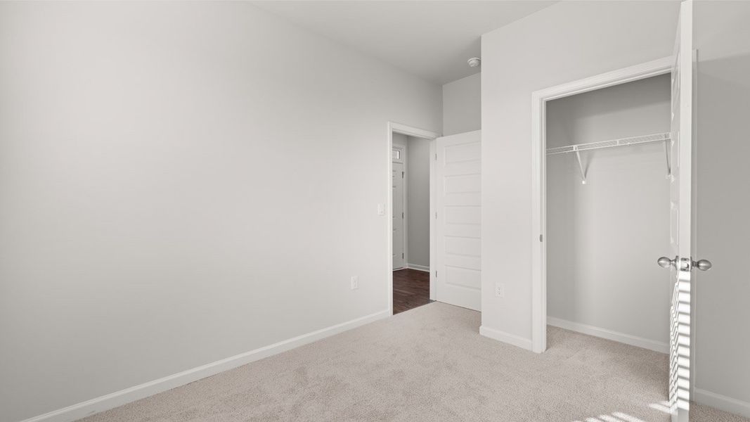 Representative unfurnished interior of a home built from the Sullivan by D.R. Horton in Byrd Village, Graniteville (Image 23).