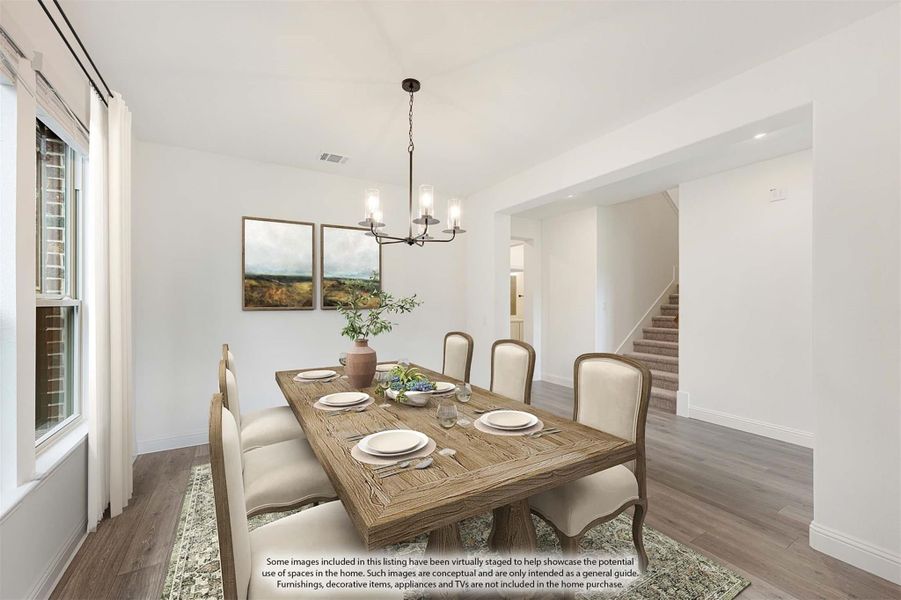 Dining room with wood table, six chairs, chandelier, and hardwood floors open to staircase Dining room with wood table, six chairs, chandelier, and hardwood floors open to staircase