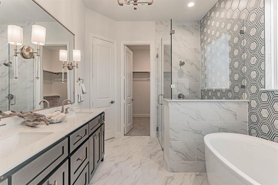 Bathroom with independent shower and bath, tile floors, tile walls, large vanity, and dual sinks