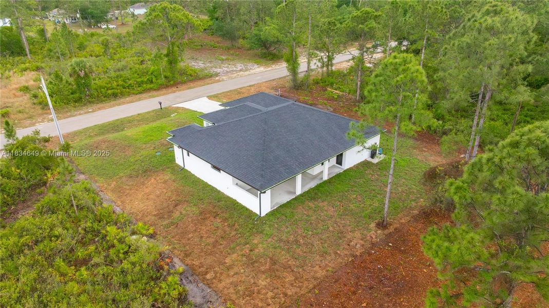 Front exterior of a new home in , Lehigh Acres, FL, highlighting curb appeal (Image 24).