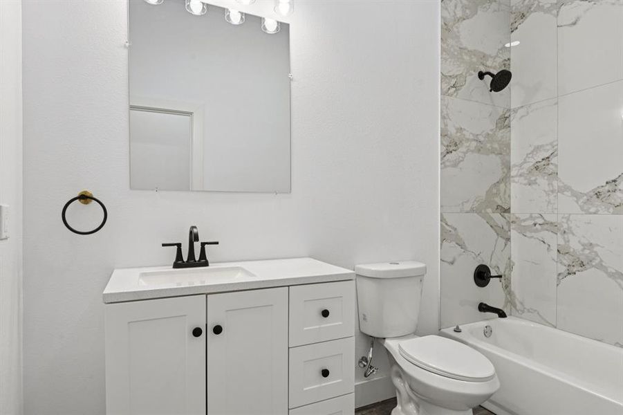 Full bathroom with vanity and washtub / shower combination Full bathroom with vanity and washtub / shower combination